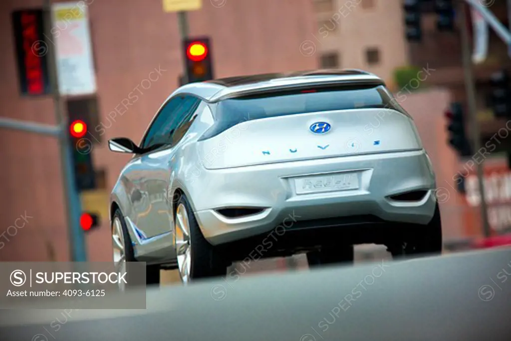 2009 Hyundai HCD-11 Nuvis Concept car approaching signals in city, rear view