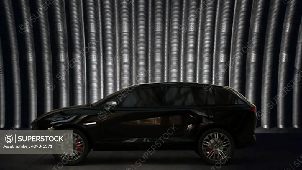 Computer-altered photography with digitally generated Image of black SUV, side view