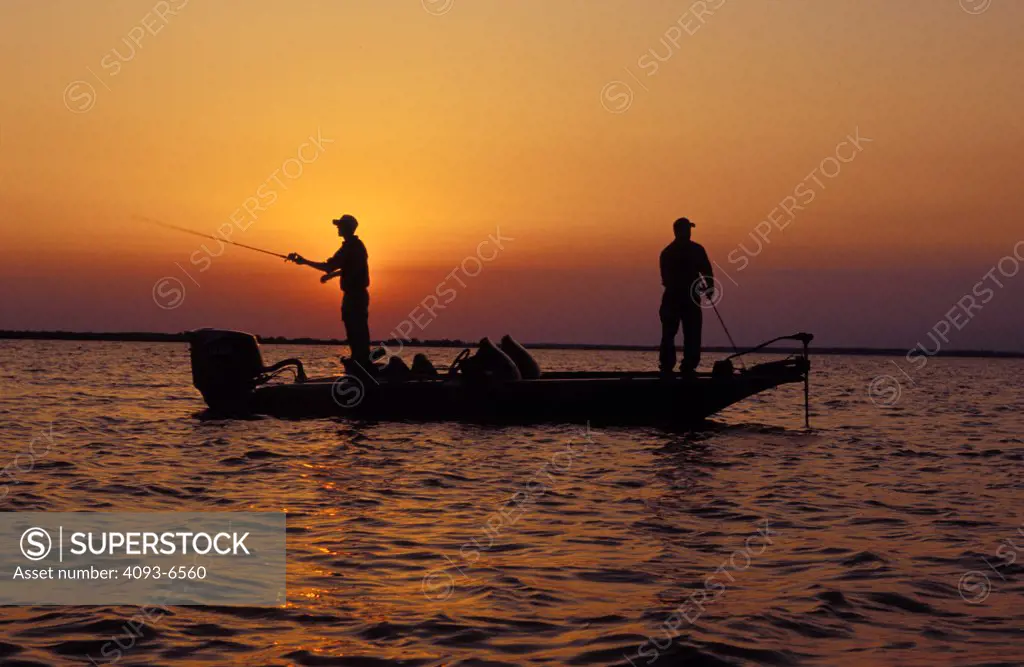 Skeeter Bass Boat outboard motor powerboat sportfishing boat fishing  profile silhouette bay - SuperStock