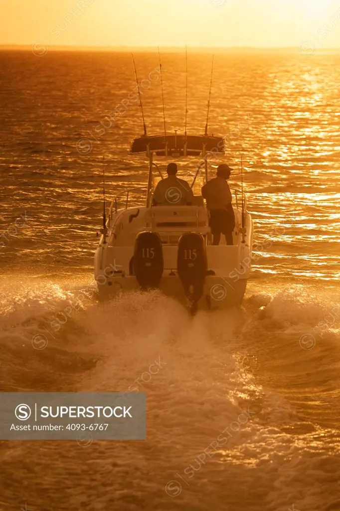 Sun Chaser outboard motors wake men