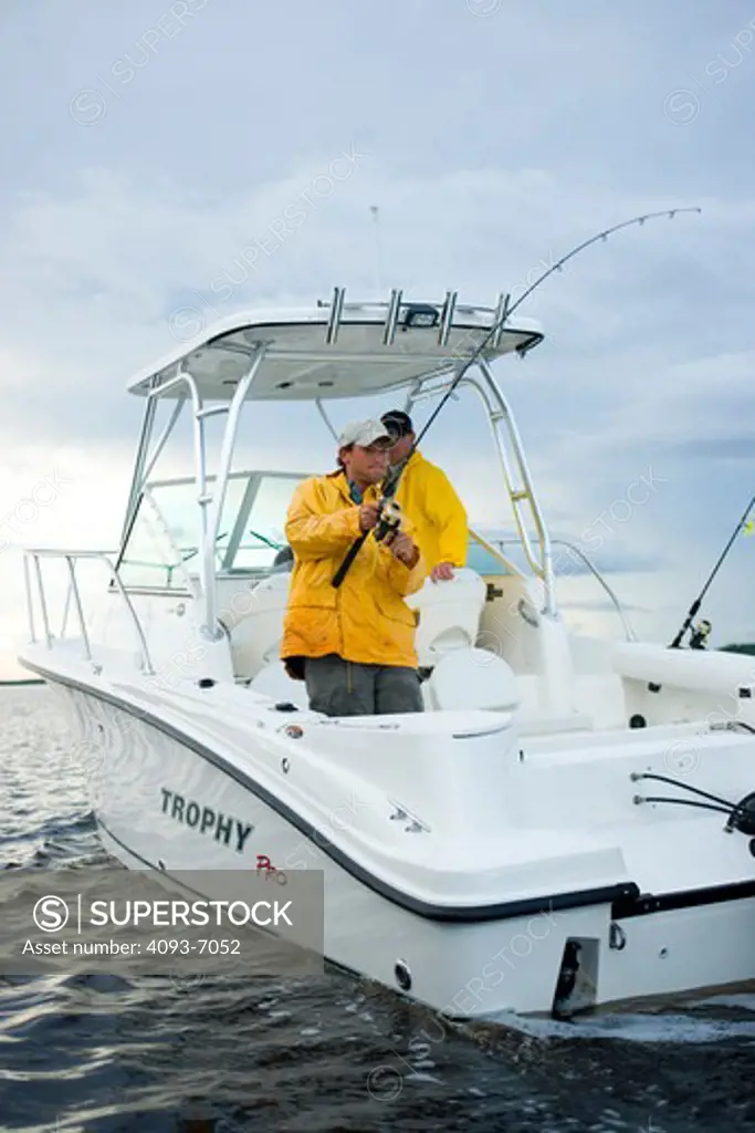 Catching fish in San Carlos Bay at sunset in a Trophy 2302 Walkaround boat. Fort Myers, Florida.