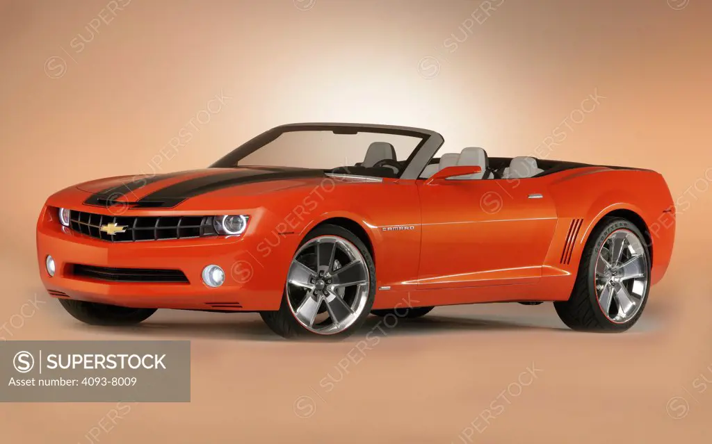 Front 3/4 view of a Chevy Camaro Convertible concept car. parked in a studio with backdrop
