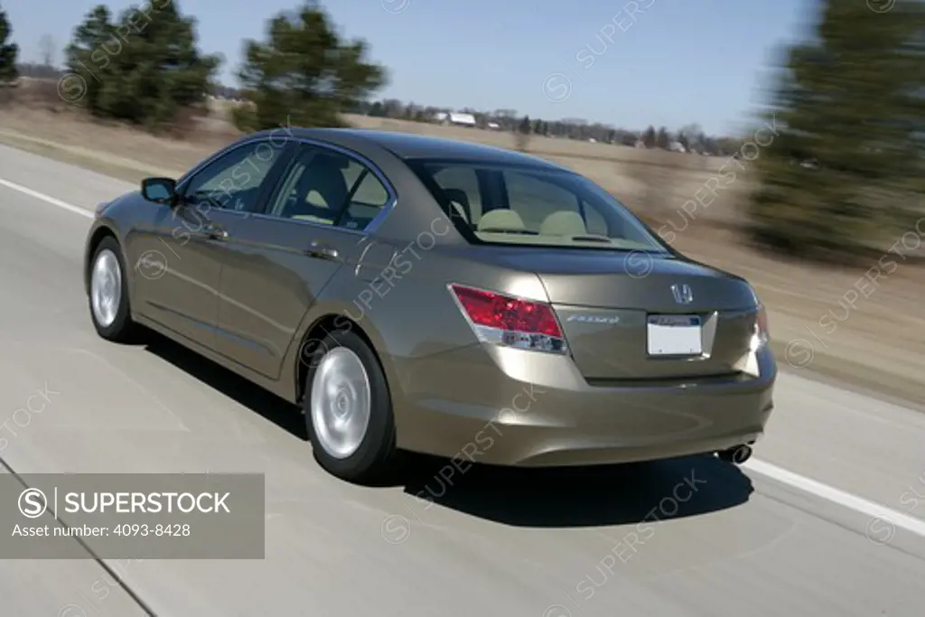 2010 Honda Accord driving along road, rear view