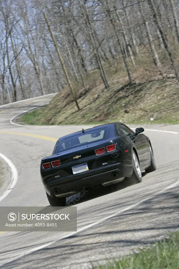2010 Chevrolet Camaro driving along road, rear view