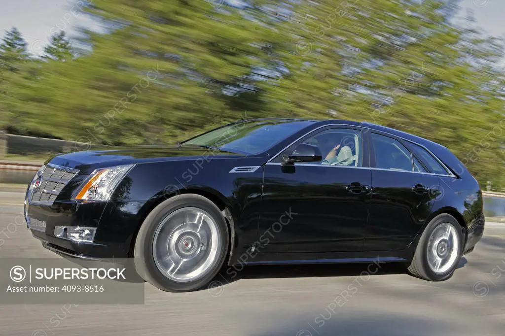 2010 Cadillac CTS Sport Wagon on the move, side view