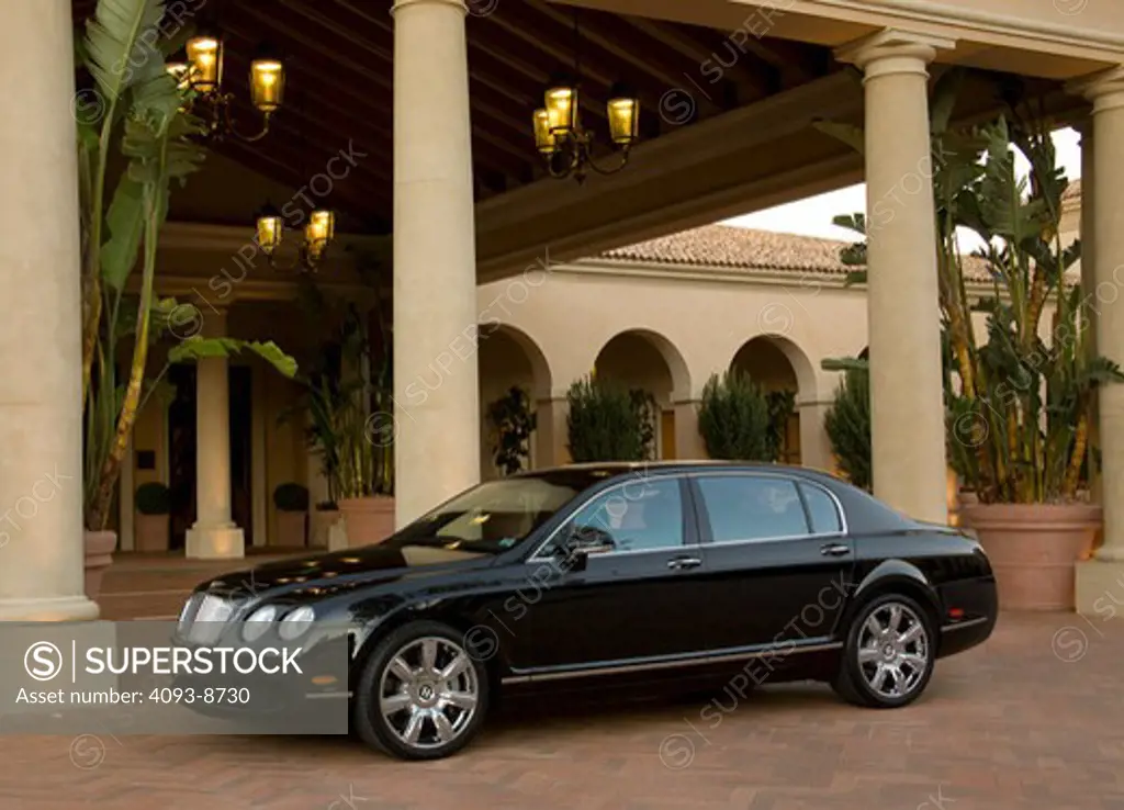 2009 Black Bentley Continental Flying Spur parked in courtyard