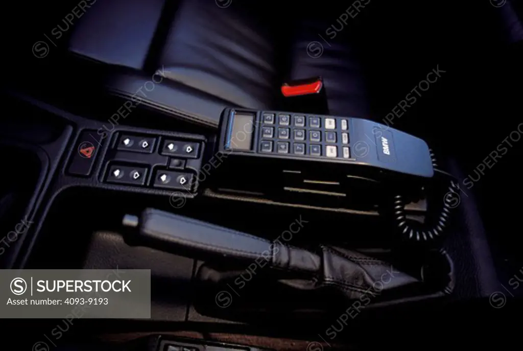 interior BMW detail black leather cellular car phone emergency brake automatic window controls