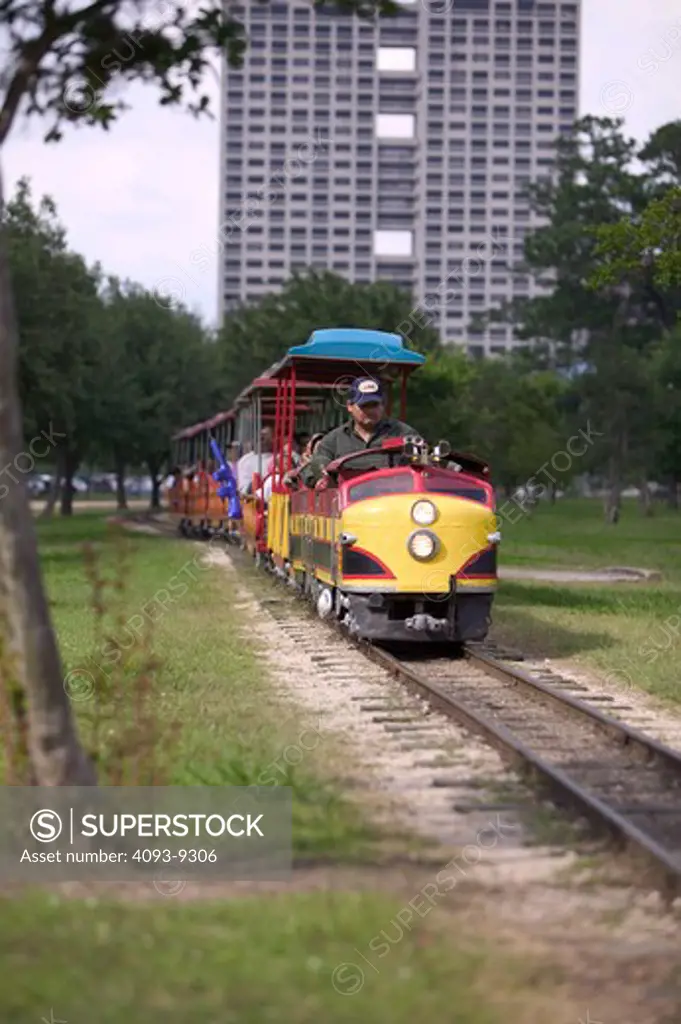 toy train amusement park passengers tracks street