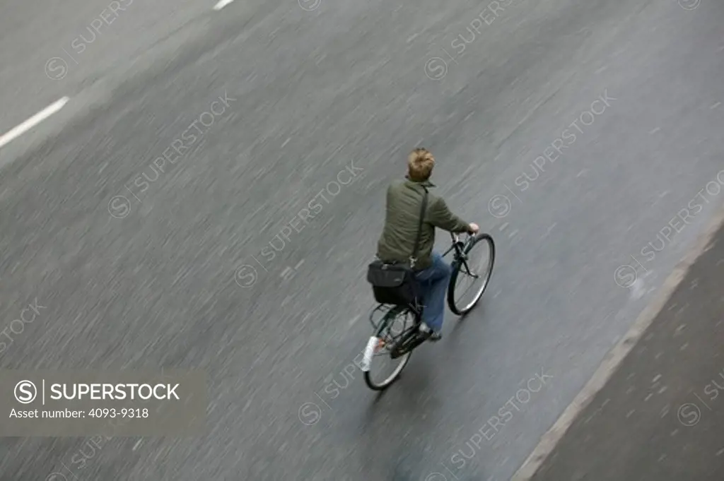 high angle person jacket bag riding street