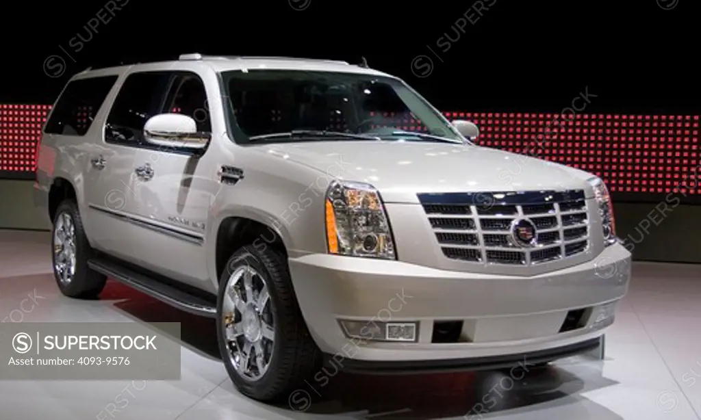 2007 white Cadillac Escalade . The all-new 2007 Escalade is the next generation of Cadillac's iconic luxury SUV and is based on General Motors' all-new full-size SUV platform.  Changes include new styling  chassis  interior and safety features  as well as an all-aluminum  6.2-liter  403 horsepower V-8.  Escalade ESV is identical to the standard Escalade from the front doors forward  but is 21 inches longer in the back and offers a new rear-seat DVD entertainment system with two flip-down screens