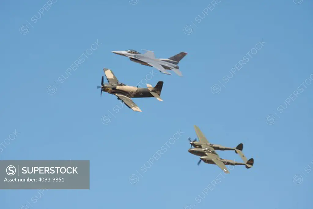 Heritage flight over Reno, Nevada during the races. Shown flying in formation is a USAF F-16, Douglas A-1 Skyraider and the famous Lockheed P-38 known as Glacier Girl.