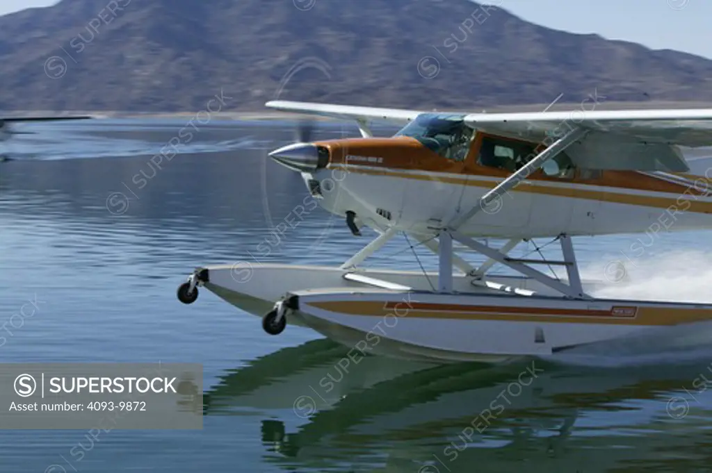 The Cessna 185, also known as the Skywagon, is a six-seat, single engined, general aviation light aircraft manufactured by Cessna. This particular version is set up on Amphibious floats. It can land on hard surfaces as well as water.