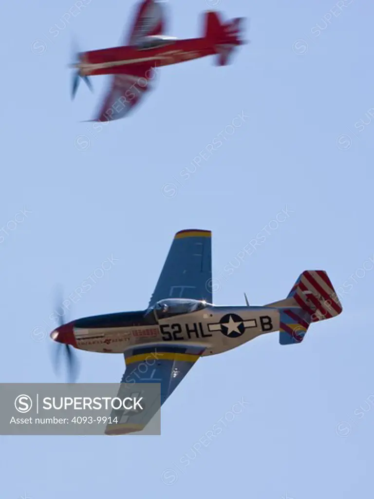 Chance Vought F4U Corsair ( known as Race 57 ) and North American P51 Mustang ( known as American Beauty 52 ) racing at the Reno Air Races in 2008.