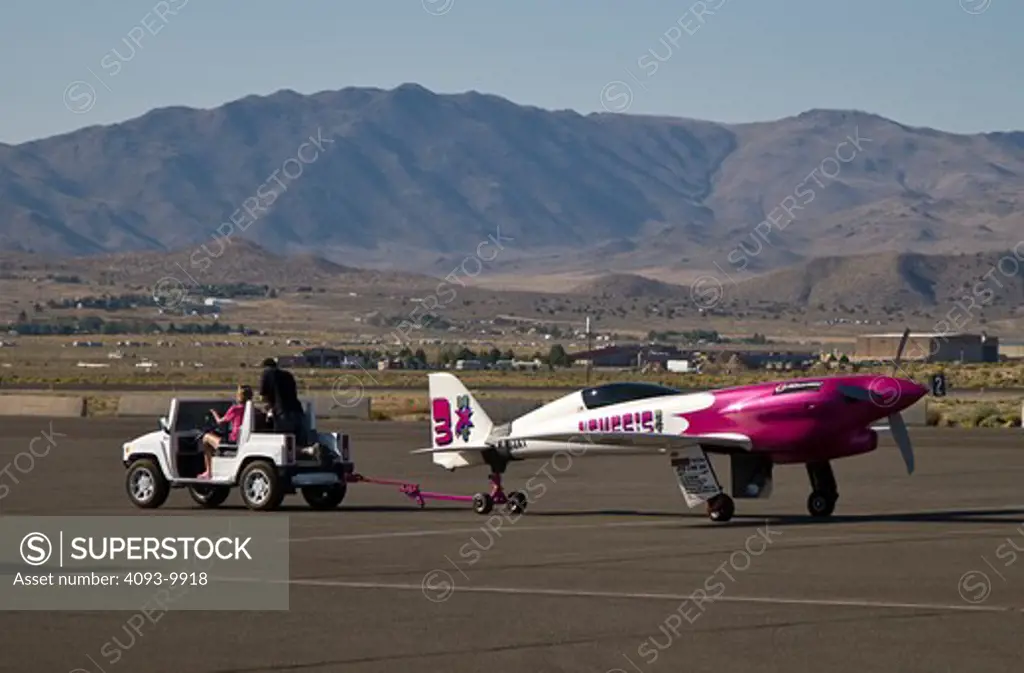 Nemesis NXT being towed after racing at the 2008 Reno Air Races. Nemesis NXT (Neoteric eXperimental Technology) is a two place, retractable gear, single engine, kit airplane of all molded carbon fiber construction allowing a very sleek aerodynamic profile. Powered by a Lycoming TI0-540-NXT engine and a Hartzell Three Blade Propeller, Nemesis NXT is a high performance personal transportation and racing airplane available in kit form.