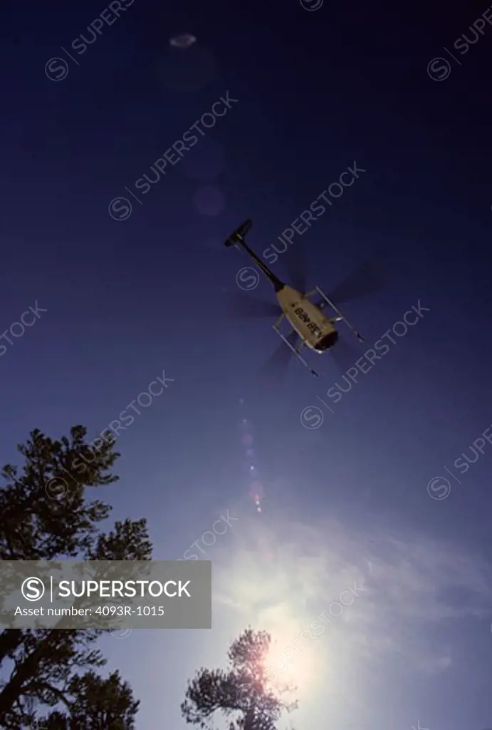low angle Helicopters Bell Aviat lens flare rotor blades