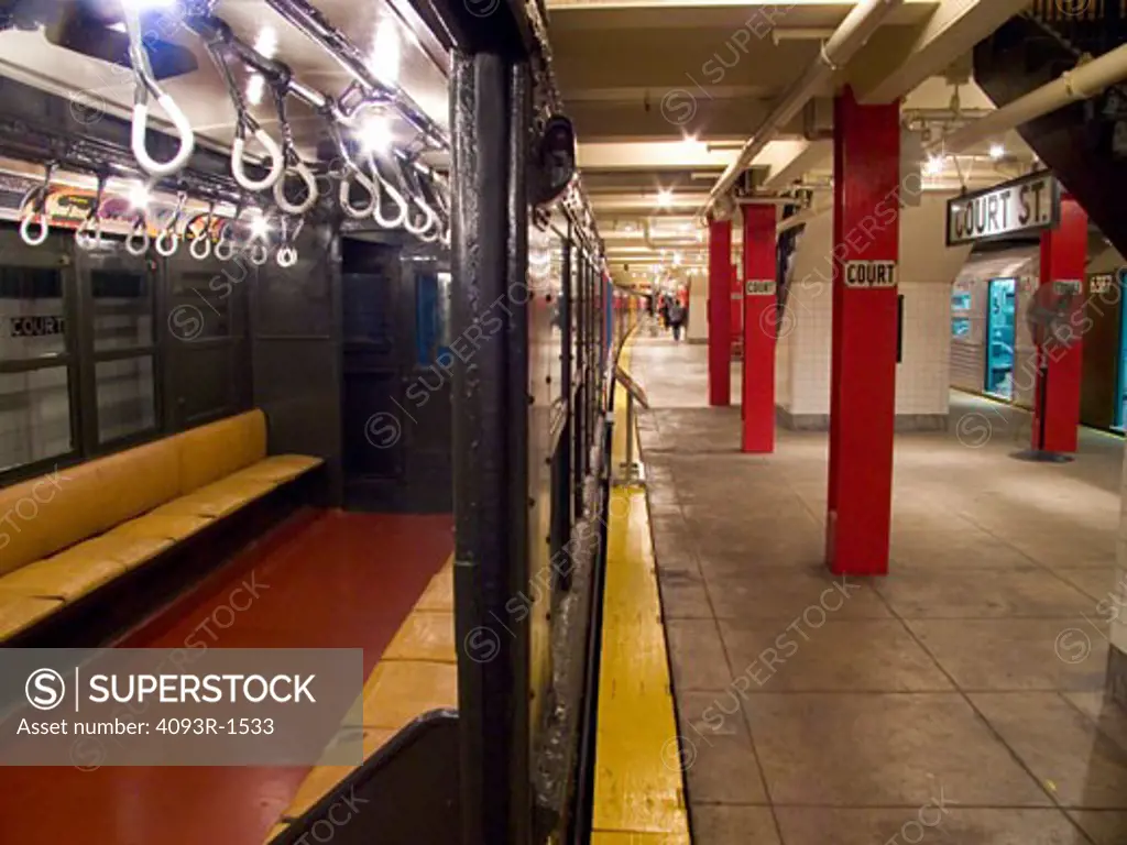 interior subway New York City open doors station platform handles city