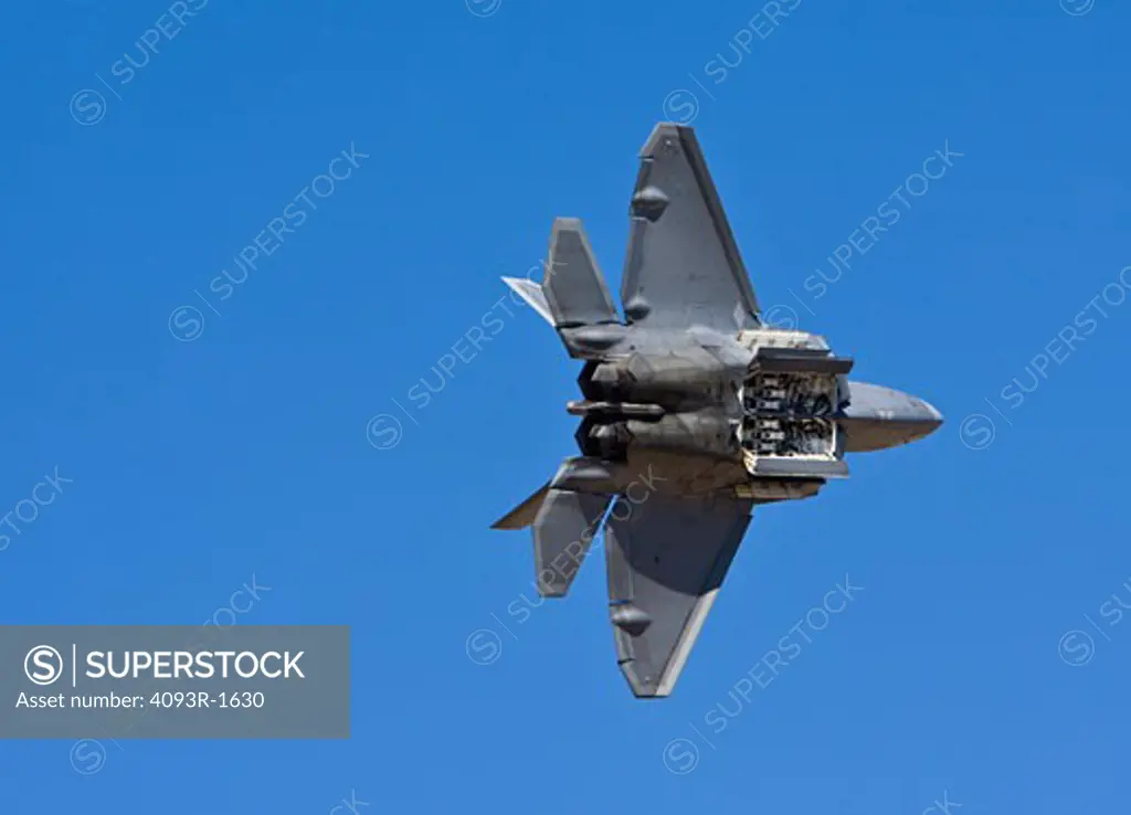 US Air Force Lockheed Martin Boeing F-22 Raptor performing an aerial demonstration at the 2008 Reno Air Races. It is primarily an air superiority fighter. Showing it's missle bays open during a fly-by.