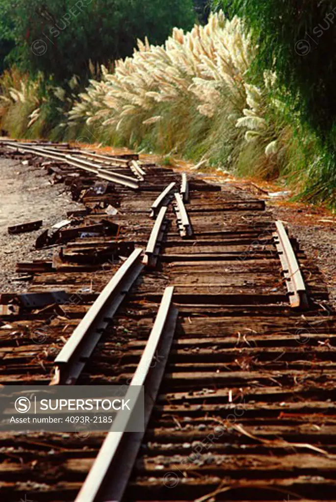 The old Southern Pacific track that ran from Saugus California to Ventura California is being removed near Valencia California in May or 1991.