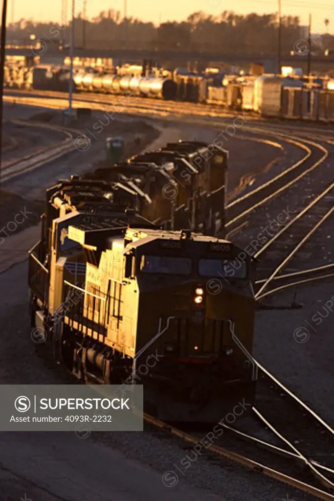 Diesel locomotives move through Union Pacific's West Colton freight yards in Colton California on their way to their next assignment. Train passing through in motion