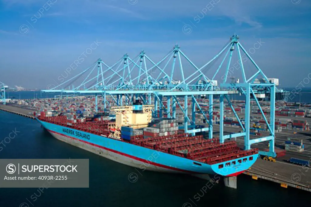 Susan Maersk container ship being loaded and unloaded at the Maersk terminal at the Port of Long Beach, California.