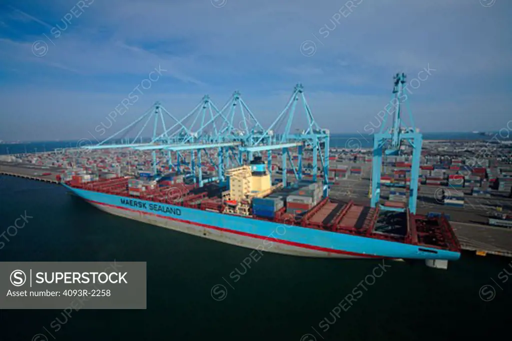 Susan Maersk container ship being loaded and unloaded at the Maersk terminal at the Port of Long Beach, California.