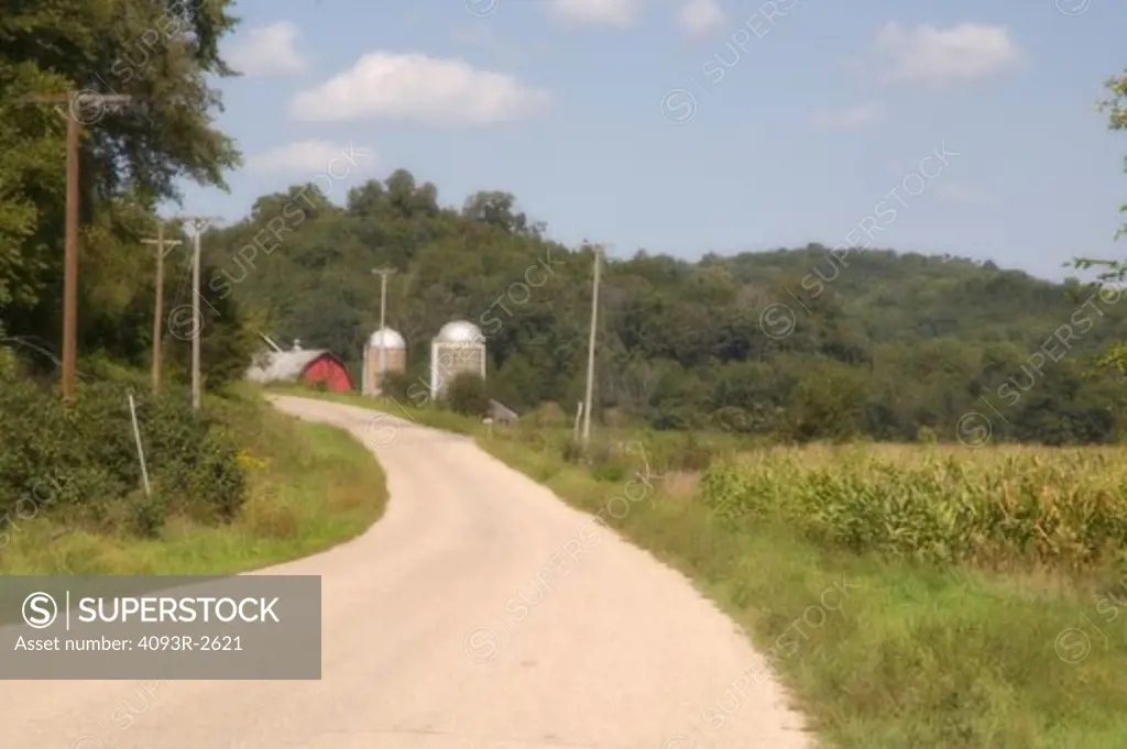 Winding rural road, barn and silos, southwest Wisconsin