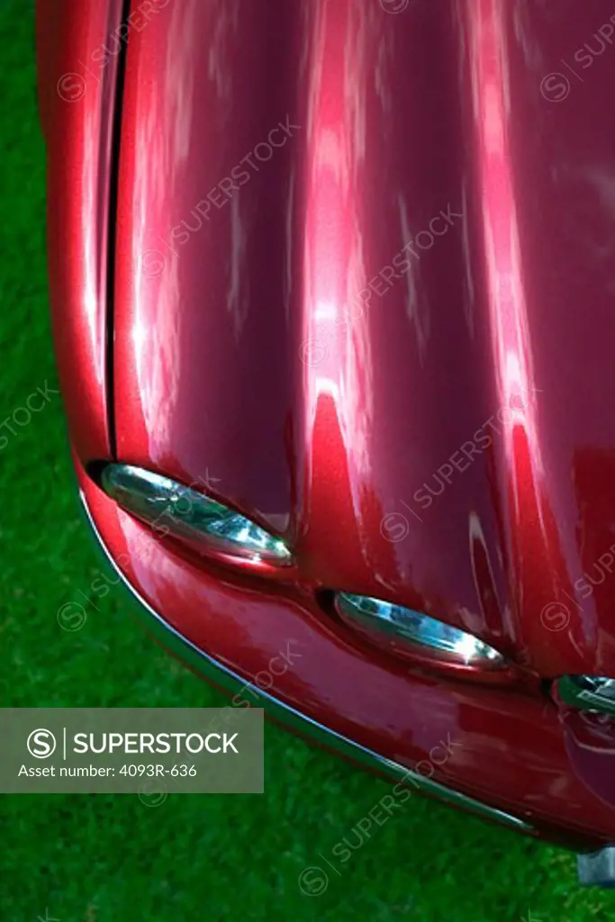 overhead high angle detail Jaguar X-Type 2005 red headlights hood