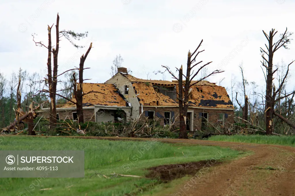 House and trees damaged by tornado, Limestone County, Alabama, USA