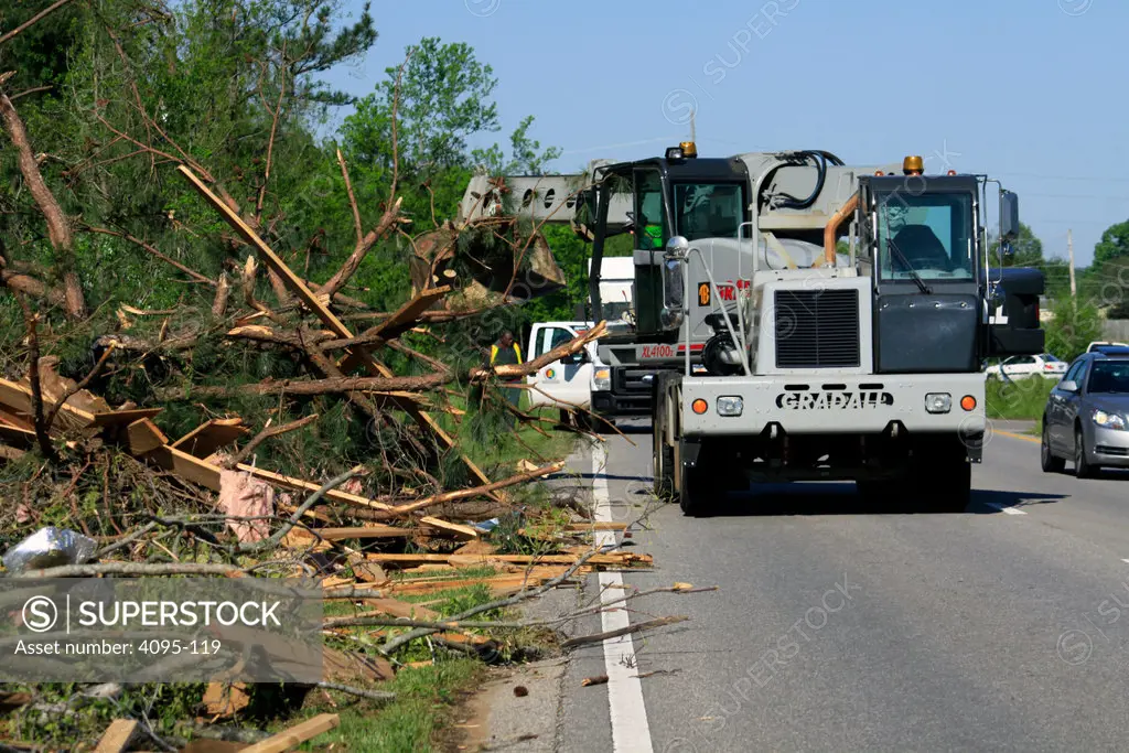 State highway crew cleaning debris from a road after a tornado, Alabama, USA
