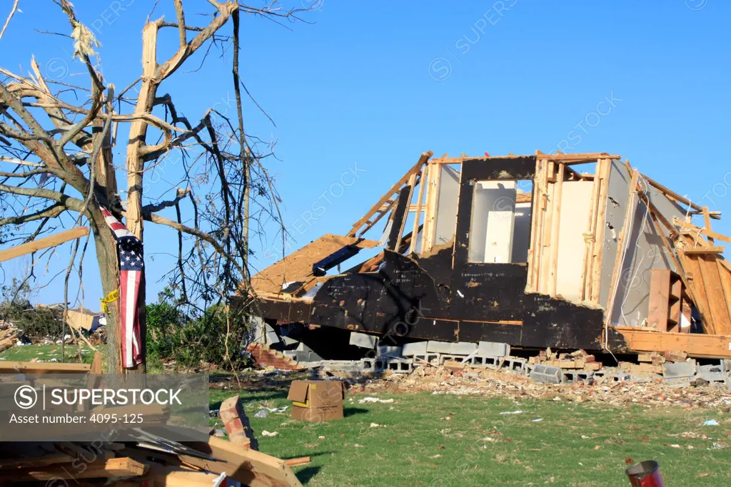House with tree damaged by tornado, Alabama, USA