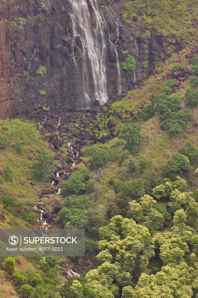 High angle view of a stream with waterfall in the background, Kokee Streem, Waimea Canyon, Kauai, Hawaii, USA