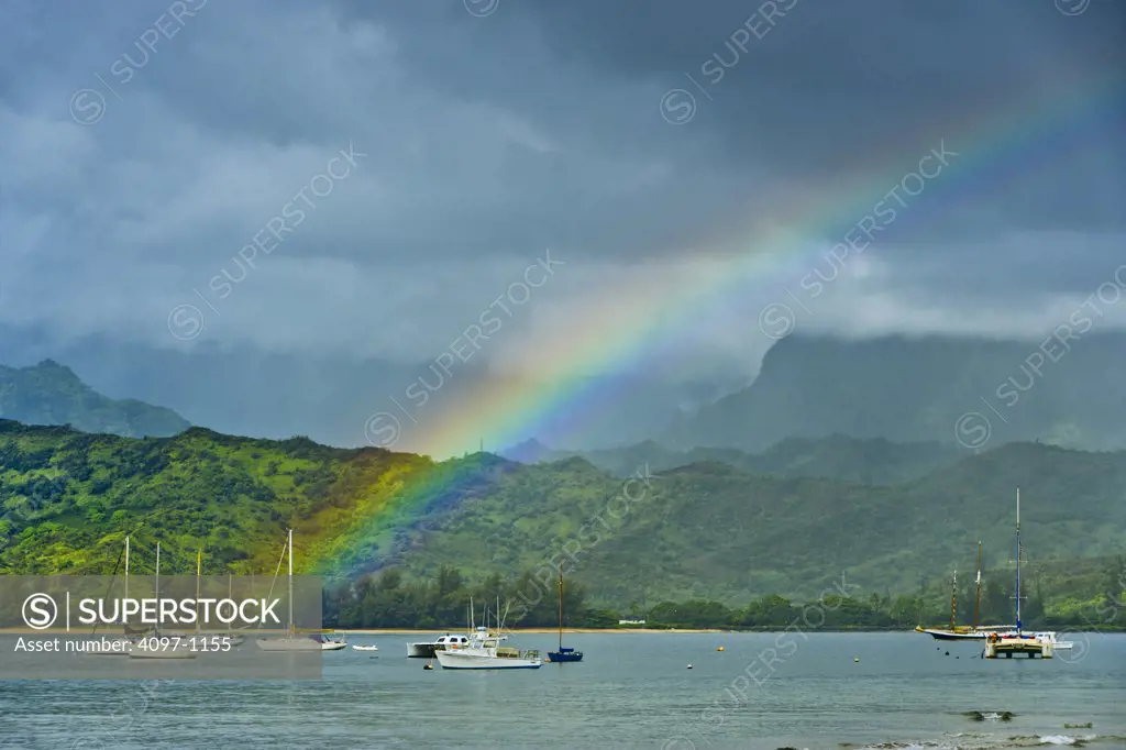 Sailboats in a bay with a rainbow, Hanalei, Kauai, Hawaii, USA