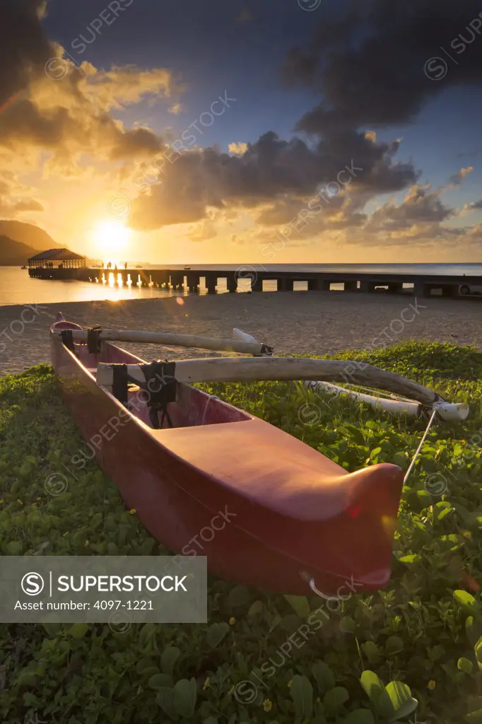 Boat on the beach with pier in the background, Hanalei Harbor, Hanalei Bay, Kauai, Hawaii, USA