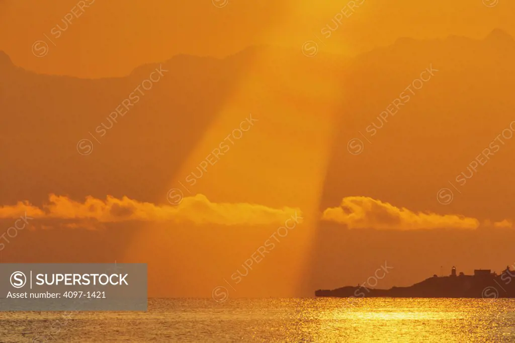 Silhouette of mountains at sunrise, Ballenas Island Lighthouse, Ballenas Island, Vancouver Island, British Columbia, Canada