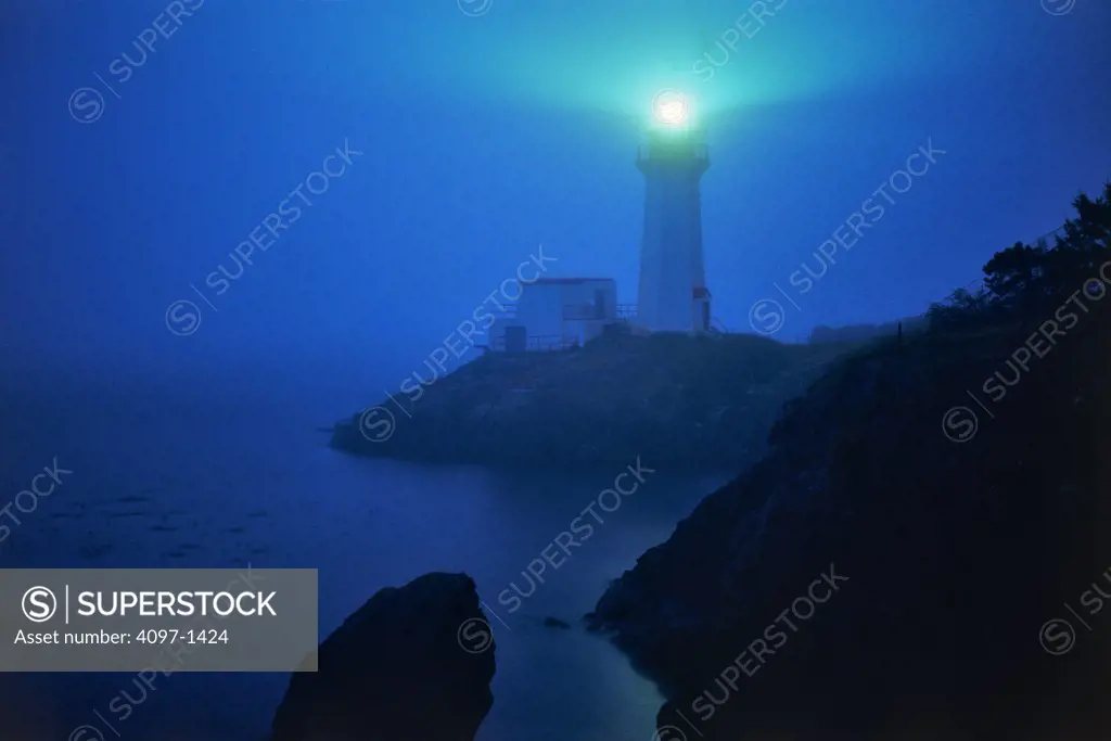 Lighthouse lit up at sunset, Sheringham Point Lighthouse, Vancouver Island, British Columbia, Canada