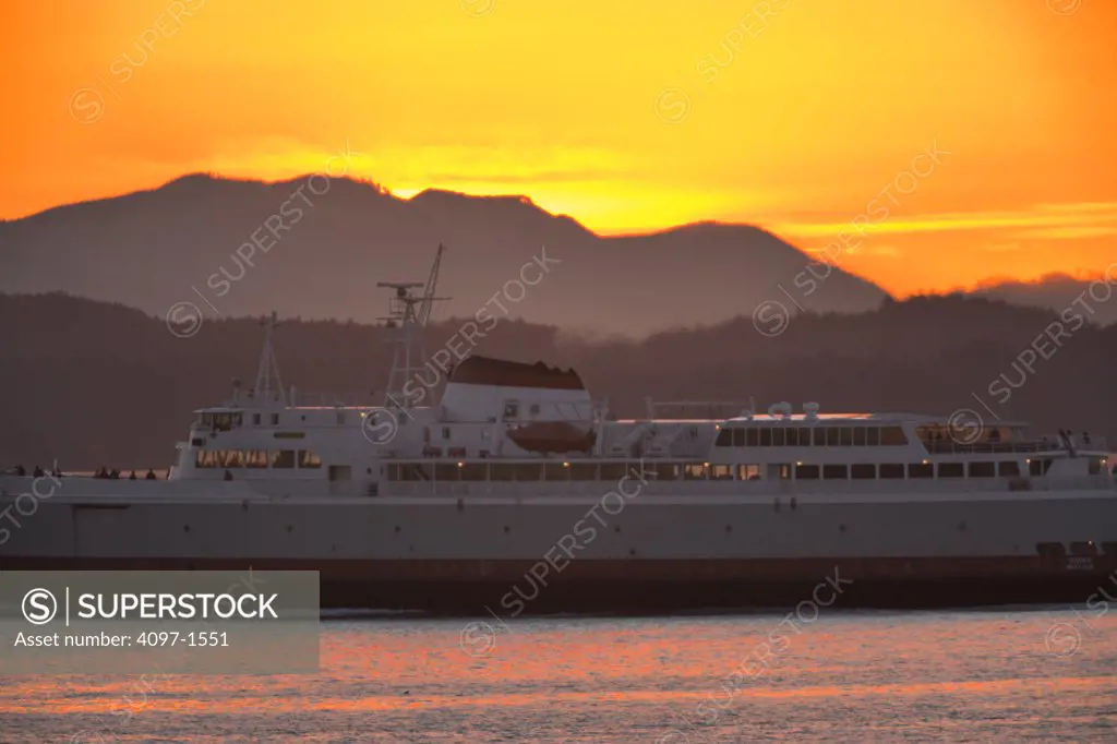 Coho ferry in the sea, Ogden Point, Olympic Mountains, Victoria, British Columbia, Canada