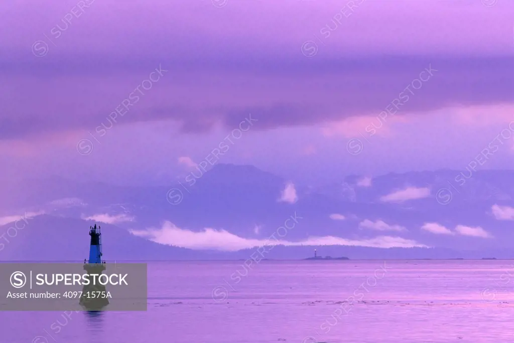 Silhouette of a navigational buoy in the sea, Strait of Juan De Fuca, Victoria, British Columbia, Canada