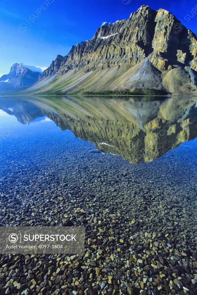 Reflection of a mountain range in a lake, Bow Lake, Banff National Park, Alberta, Canada