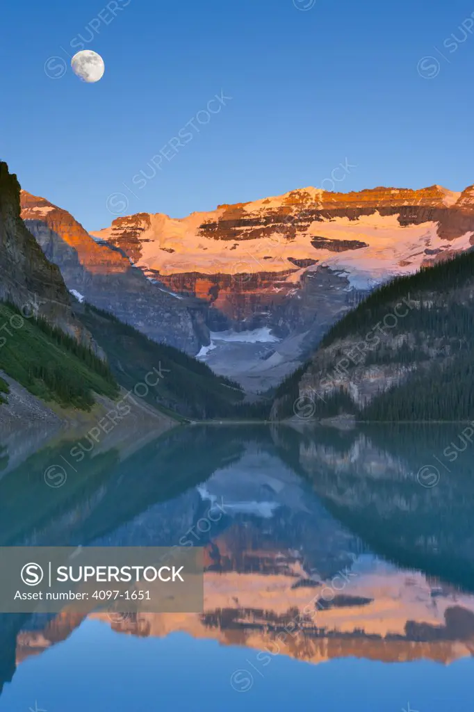 Reflection of mountains in a lake, Victoria Glacier, Lake Louise, Banff National Park, Alberta, Canada