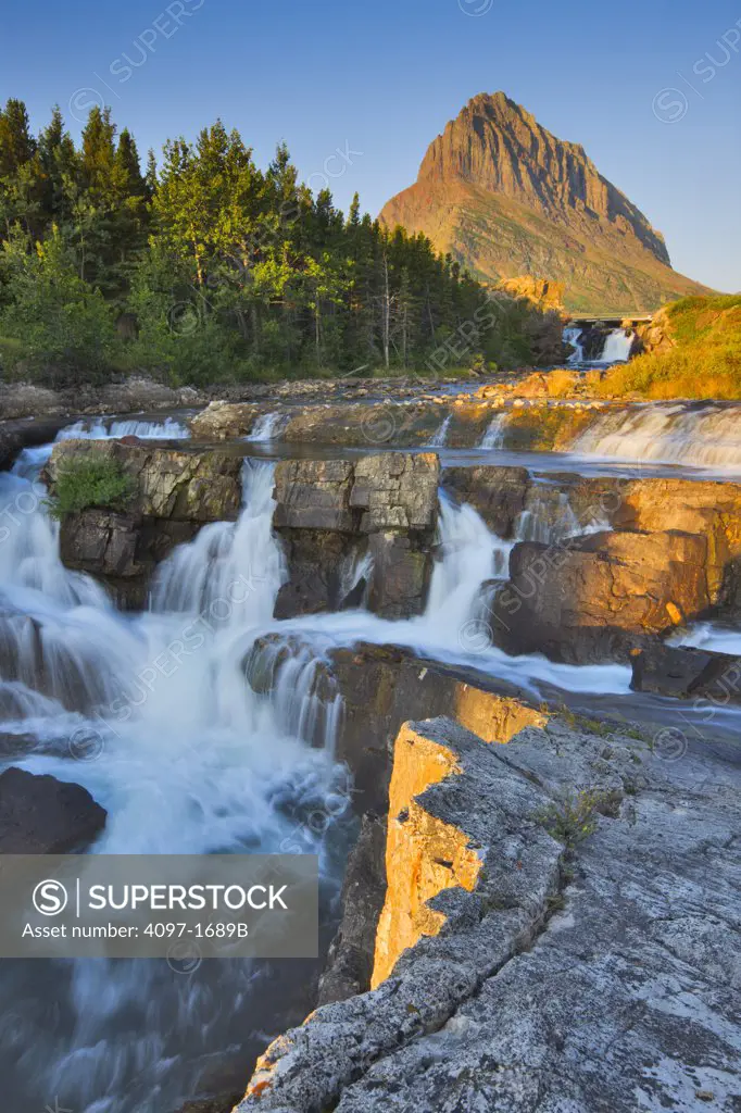 Water falling from rocks, Swiftcurrent Falls, Swiftcurrent Creek, US Glacier National Park, Montana, USA