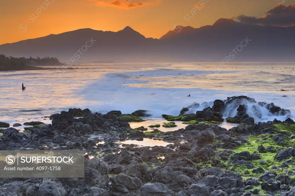 Ocean with mountains at sunset, North Maui Mountains, Hookipa Beach, Maui, Hawaii, USA