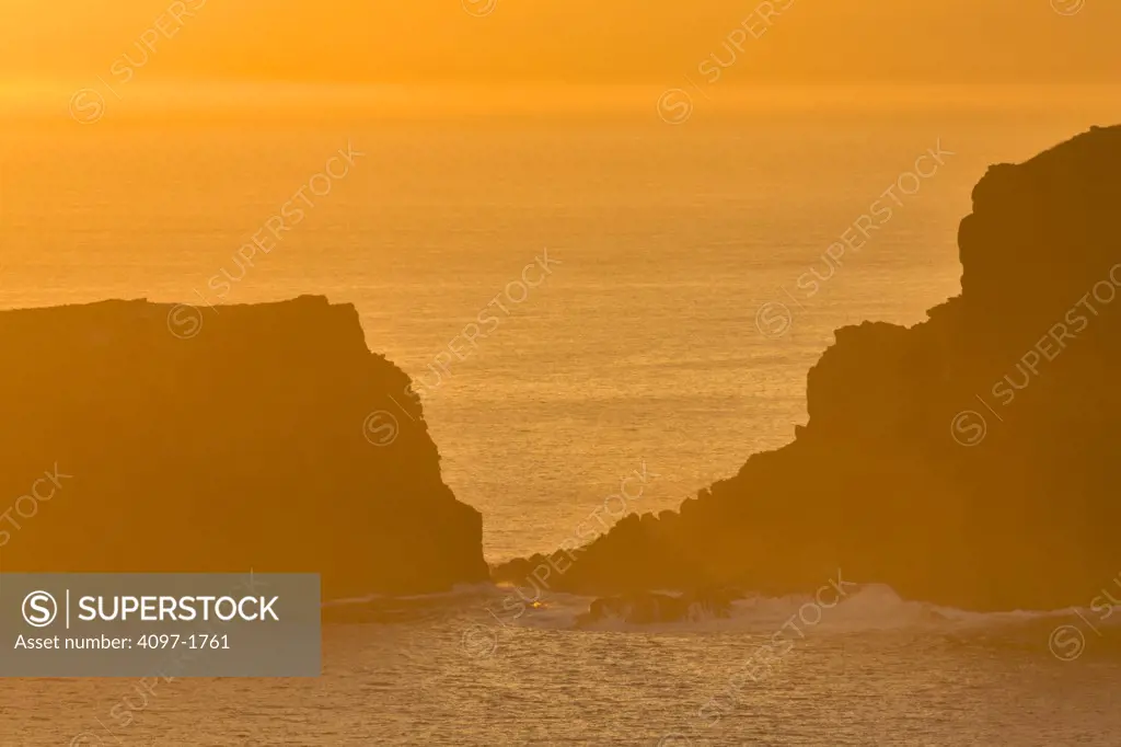 Rock formations in the ocean, Poelua Bay, Maui, Hawaii, USA