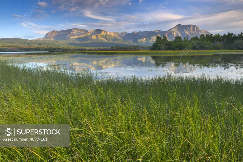 Reflection of mountains in water, Waterton Lakes National Park, Alberta, Canada