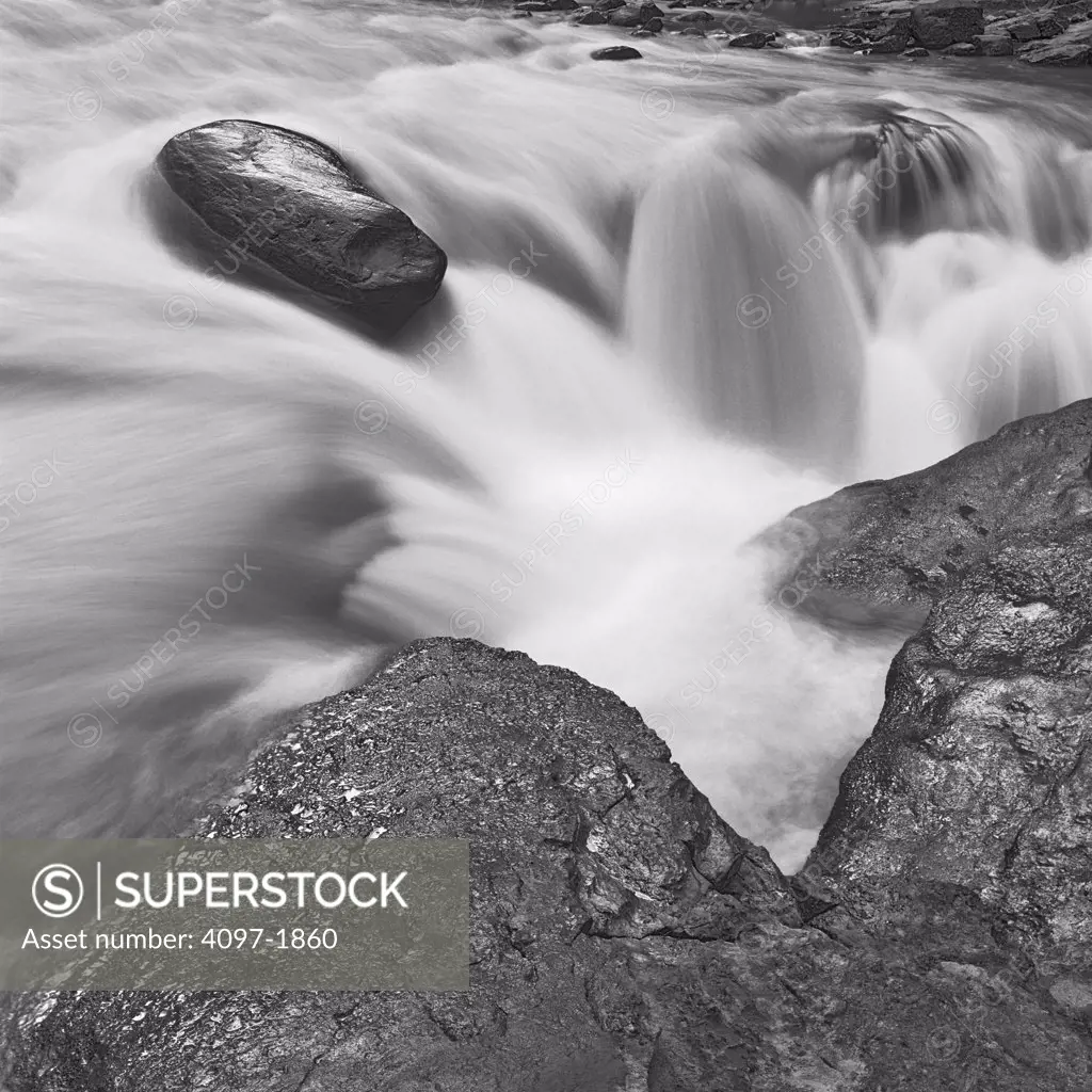 Stream flowing through rocks, Sunwapta Falls, Jasper National Park, Alberta, Canada