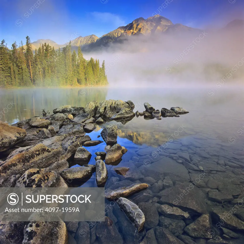 Reflection of a mountain in water, Pyramid Lake, Pyramid Mountain, Jasper National Park, Alberta, Canada