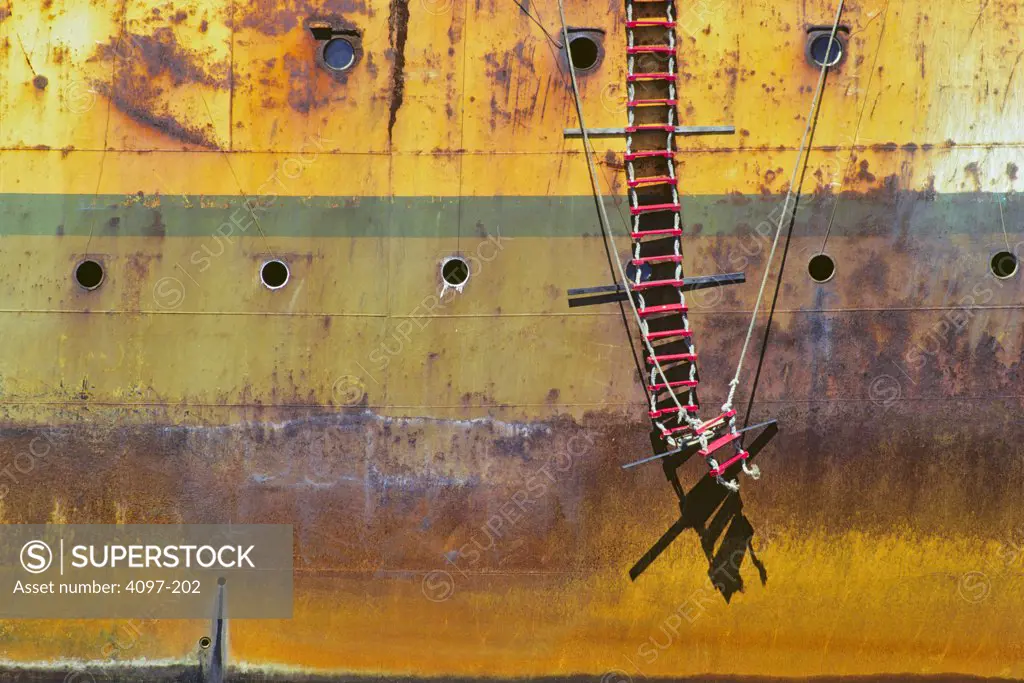 Rope ladder hanging on a rusty container ship, Victoria, Vancouver Island, British Columbia, Canada