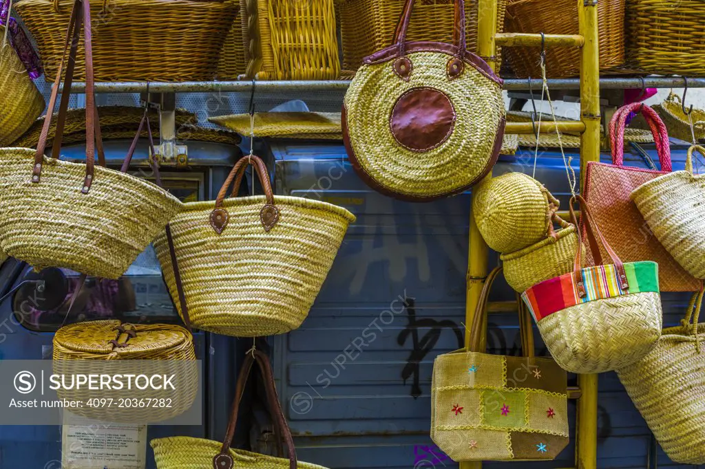 basketass for sale displayed on Piaggio Ape (motorcycle truck), Rome