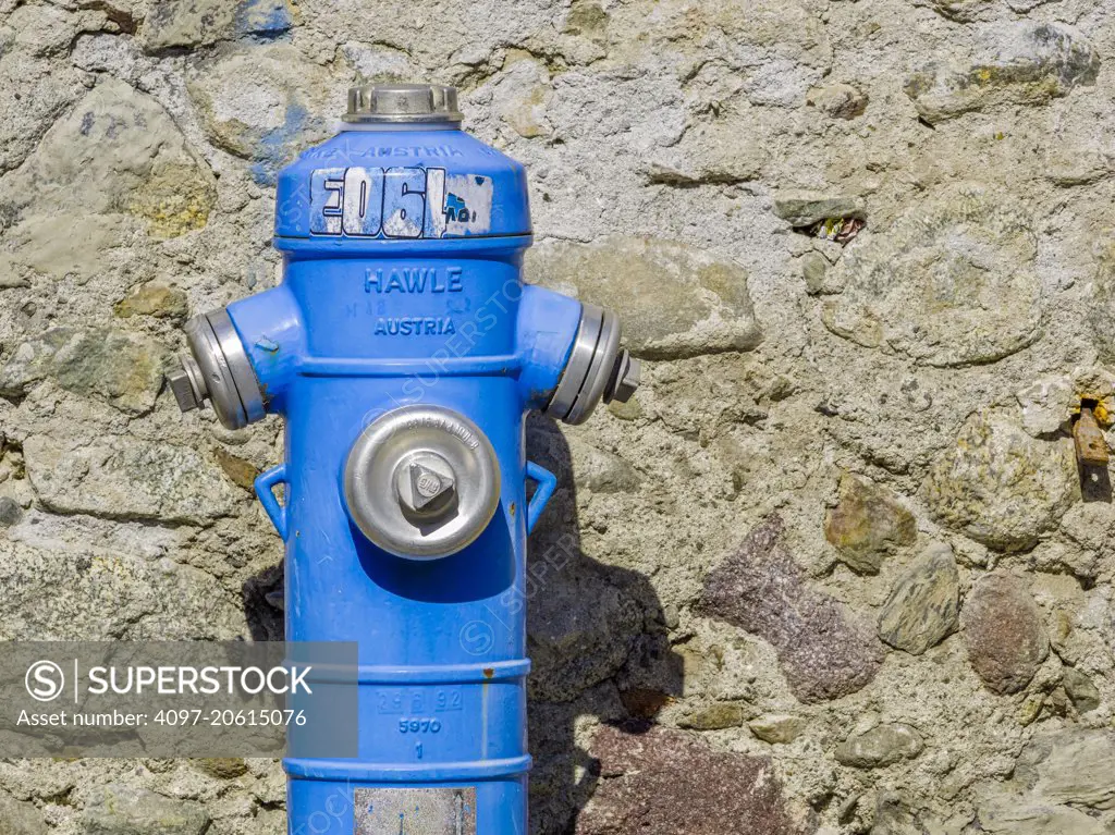 Blue fire hydrant in town of Merano in Northern Italy
