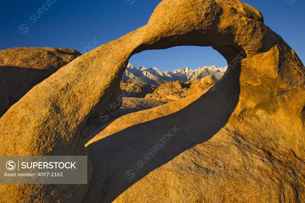 Mountains viewed through a natural arch, Mobius Arch, Alabama Hills, Californian Sierra Nevada, California, USA