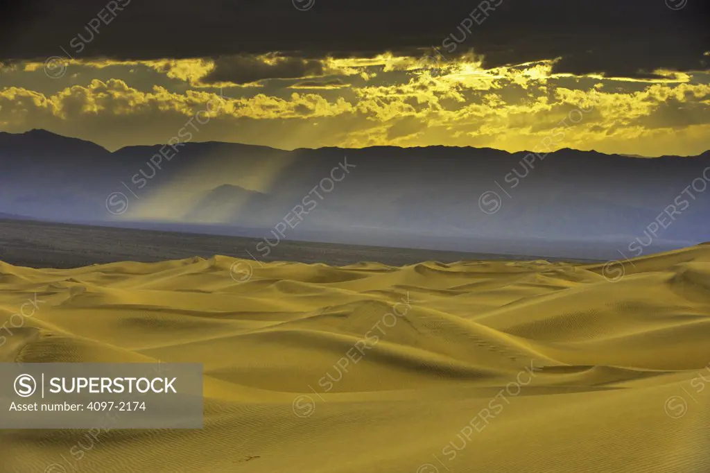 Clouds over mountain range, Panamint Range, Mesquite Flat Sand Dunes, Mojave Desert, Death Valley, Death Valley National Park, California, USA